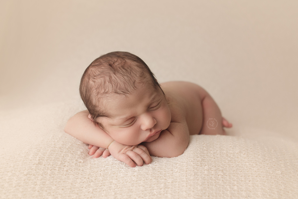 Adorable Milwaukee newborn baby making his big day extra special with pictures to cherish forever during his newborn session in Waukesha, WI.