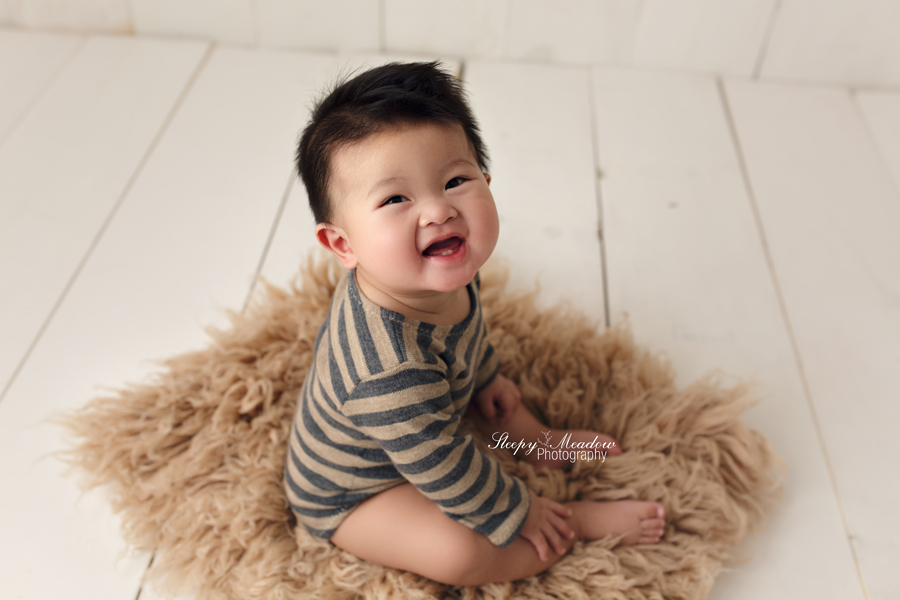 This baby was a smiles for his pictures with Sleepy Meadow Photography.