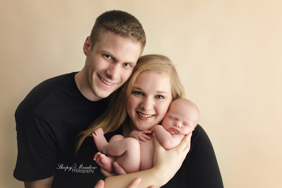 Family newborn poses at Milwaukee portrait studio by Sleepy Meadow Photography