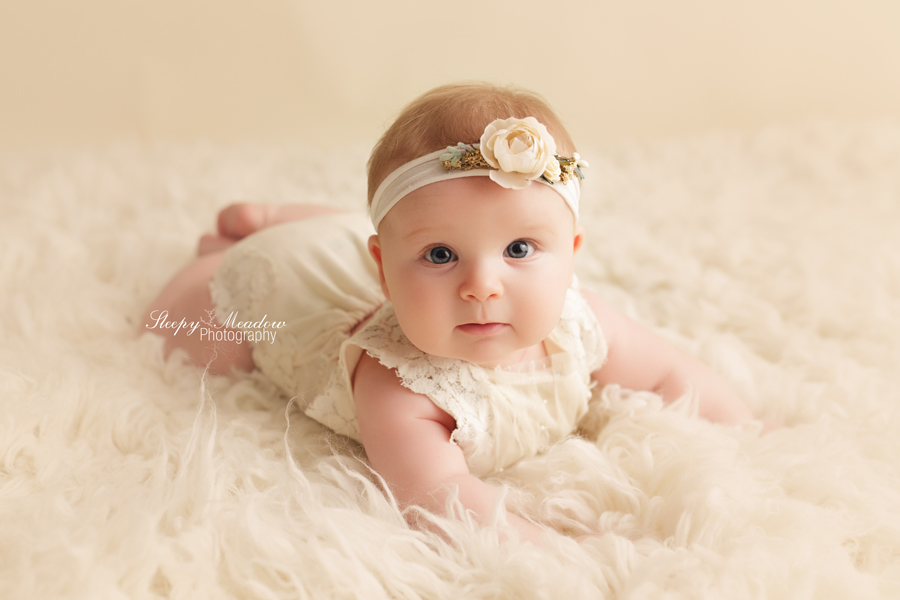 Cute 4 month old pictures on neutrally inspired set by Sleepy Meadow Photography, Milwaukee's Best Newborn Photograper.