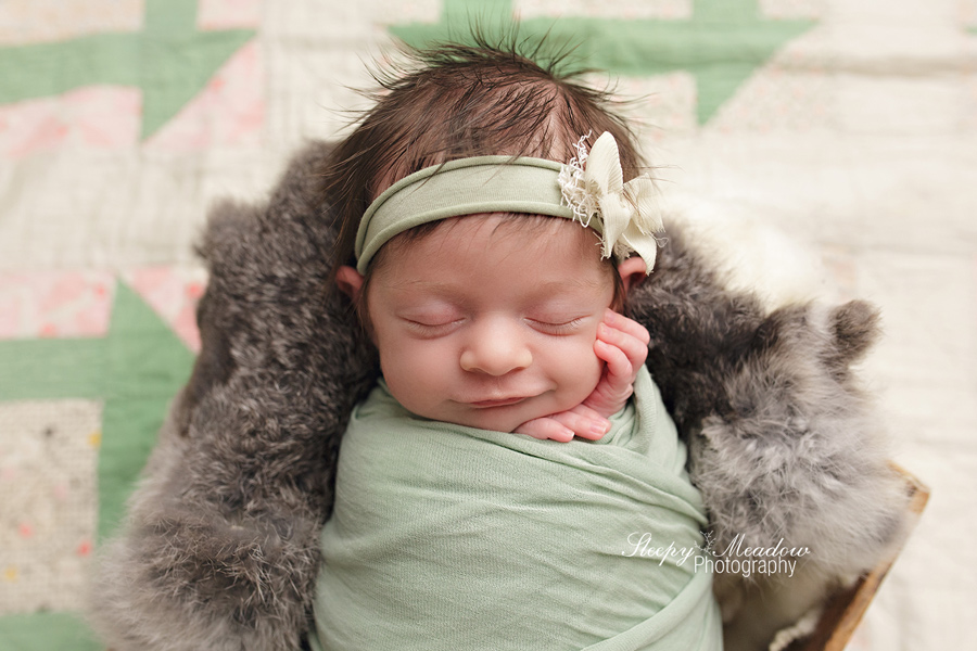 BABY GIRL SMILES FOR HER NEWBORN SESSION WITH SLEEPY MEADOW PHOTOGRAPHY | MILWAUKEE NEWBORN PHOTOGRAPHER