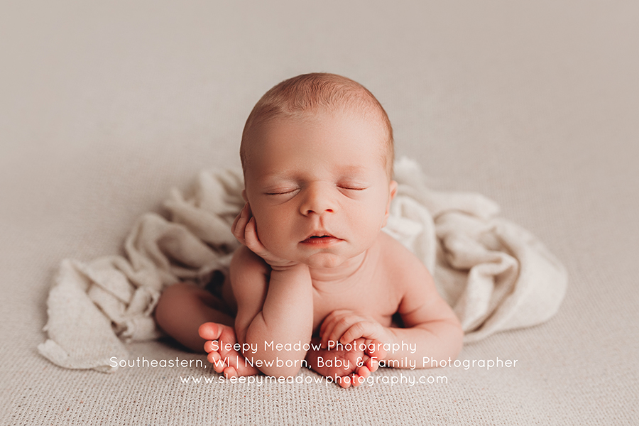 Adorably baby in froggy pose during his newborn session | Oconomowoc Portrait Studio