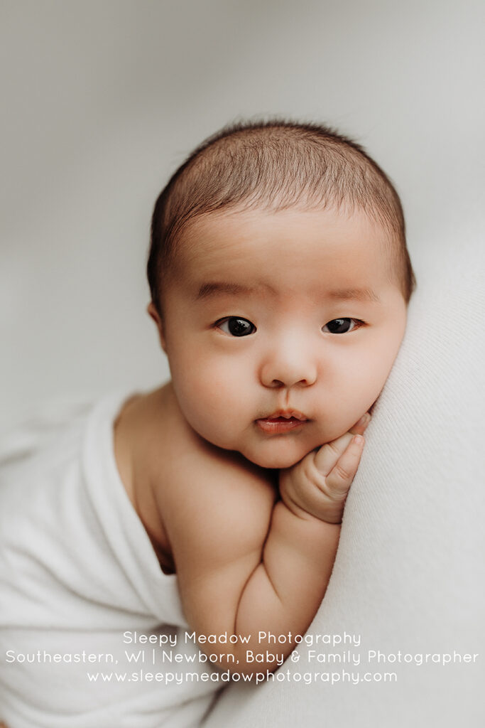 Newborn on white fabric backdrop | Brookfield Baby Photographer