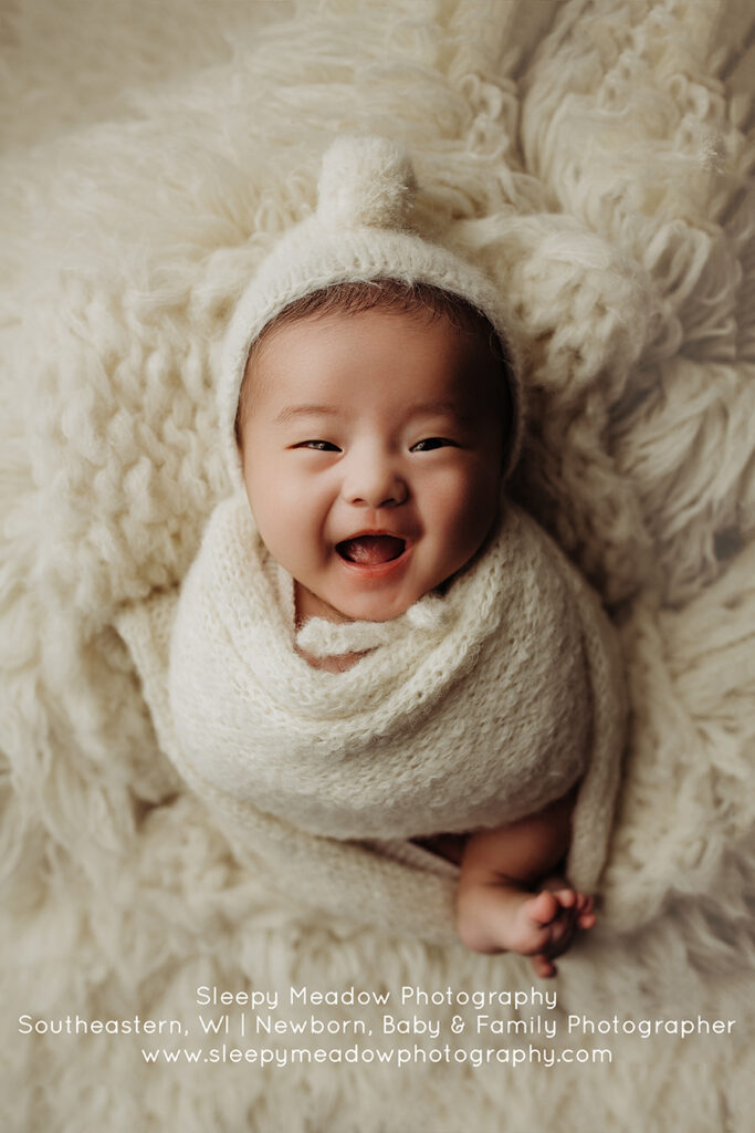 Baby Eugene in knit wrap and bonnet | milwaukee newborn photographer