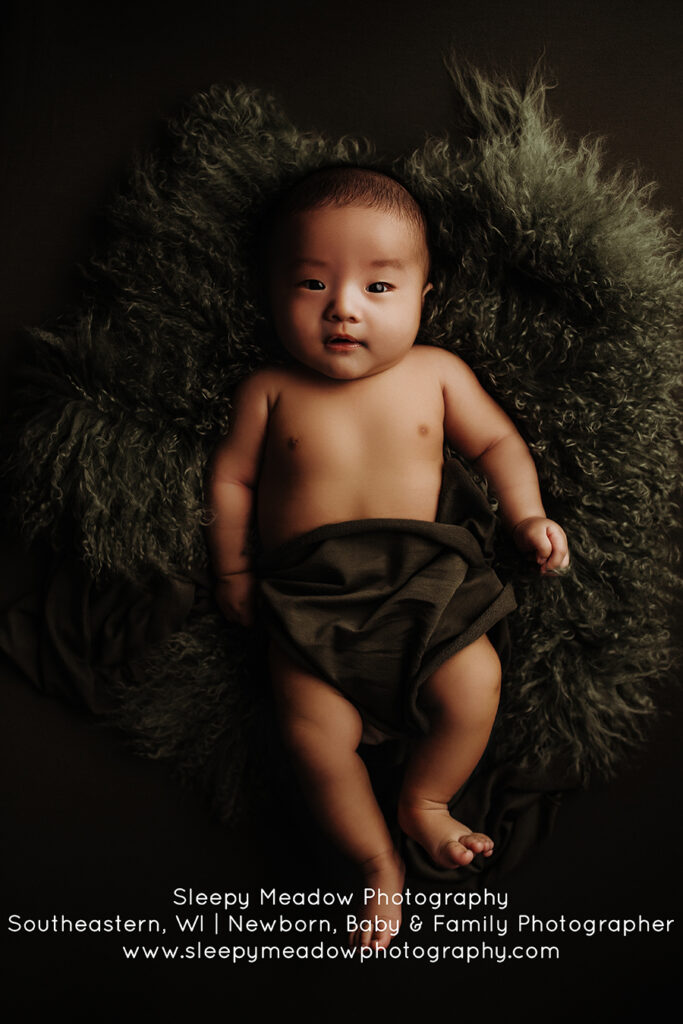 baby laying on fur | Milwaukee Baby Photography