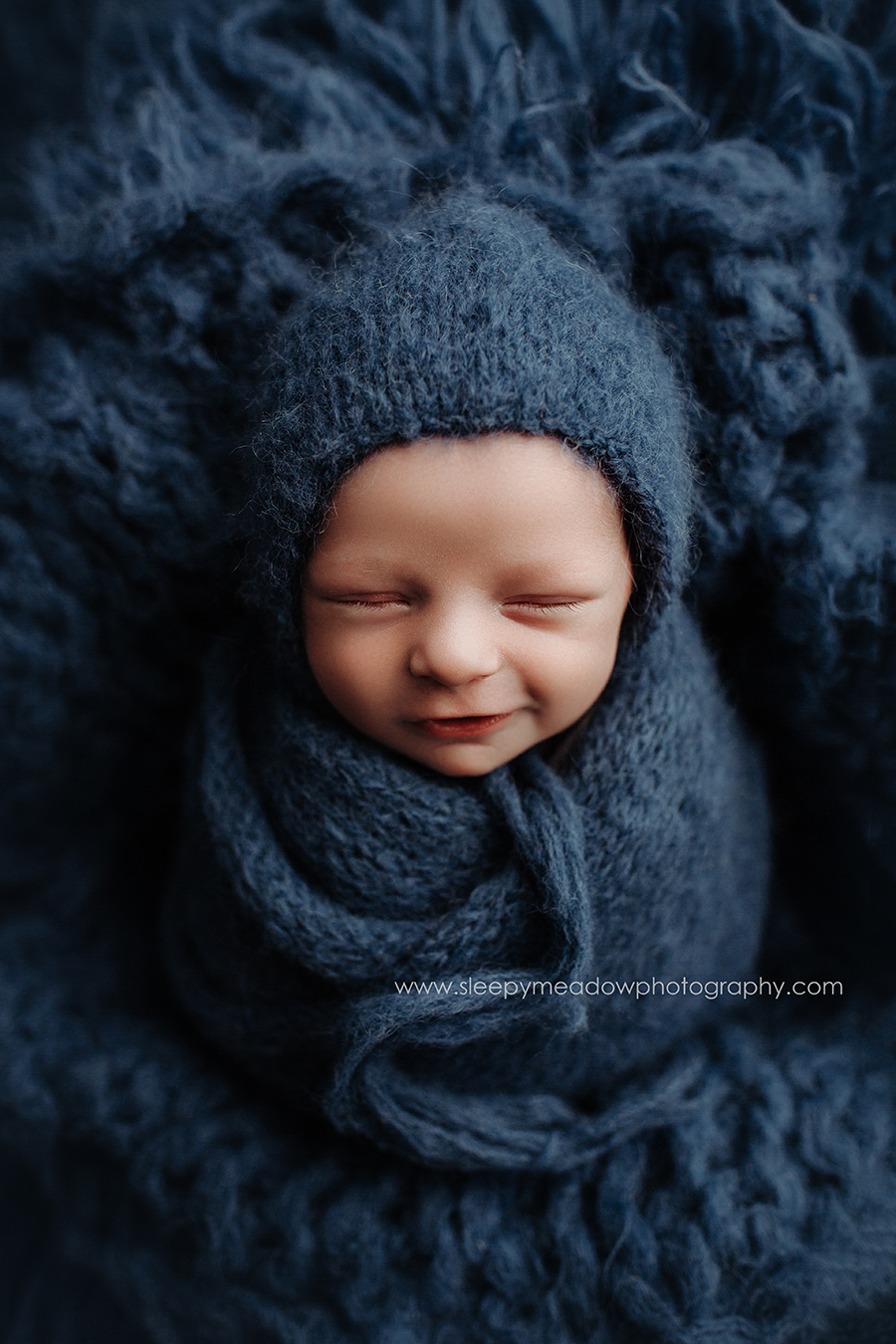 baby smiling for newborn pictures